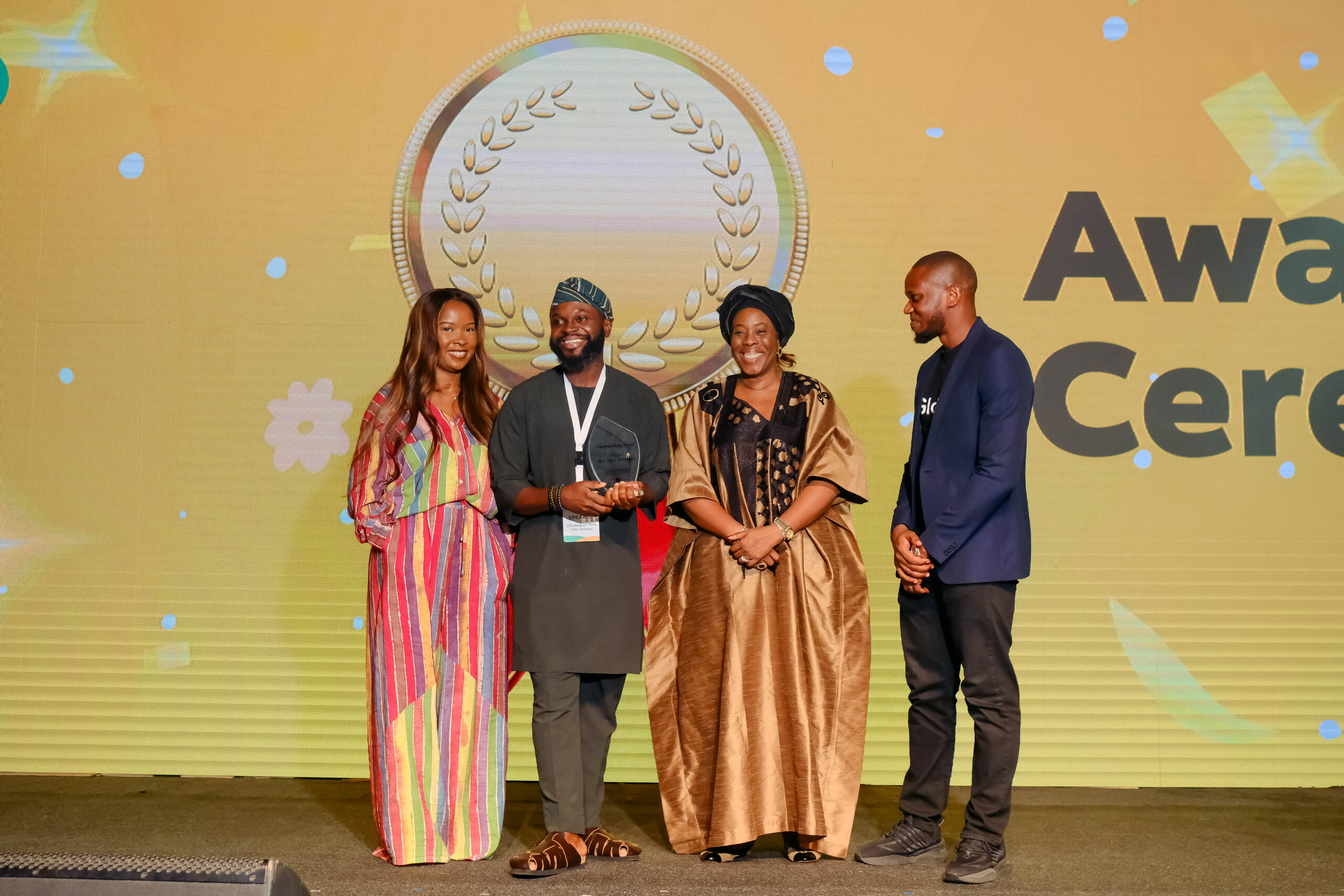 Olusegun Ake receiving the Comeback King award on stage at the Glovo Future of Commerce Summit 2025, alongside Lagos State Commissioner Folashade Bada Ambrose and other event hosts.